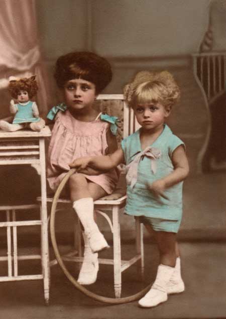 A photograph taken circa 1928 of the haunted Pupa doll, her owner, and her owner's younger brother