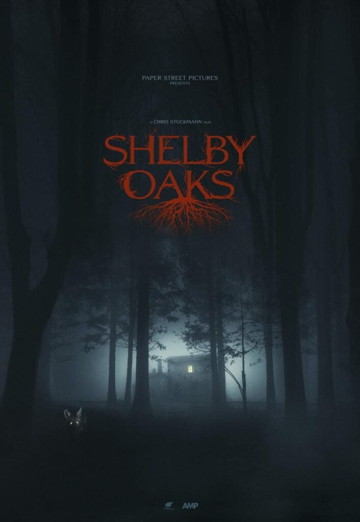 The movie poster for the feature film Shelby Oaks, featuring a house silhouetted in dark woods