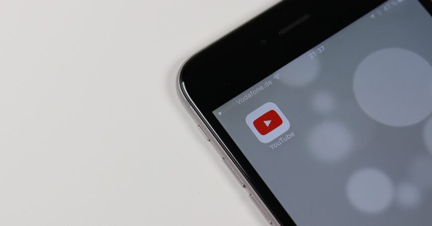 a smartphone showing the icon for the YouTube app