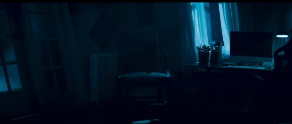 A rocking chair alone in a dark room in the Dear David movie trailer