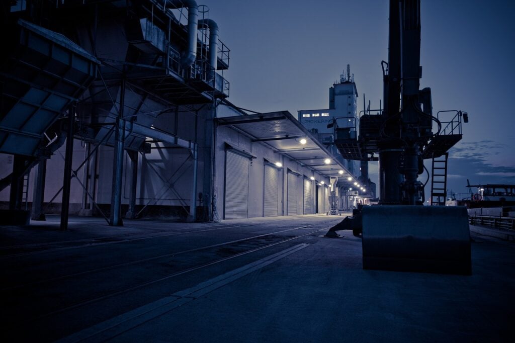 an industrial-looking ship's port at night