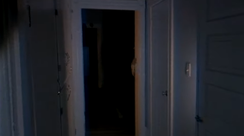 A screenshot from the second DOORS video depicting an open door frame with a single hand visible through it