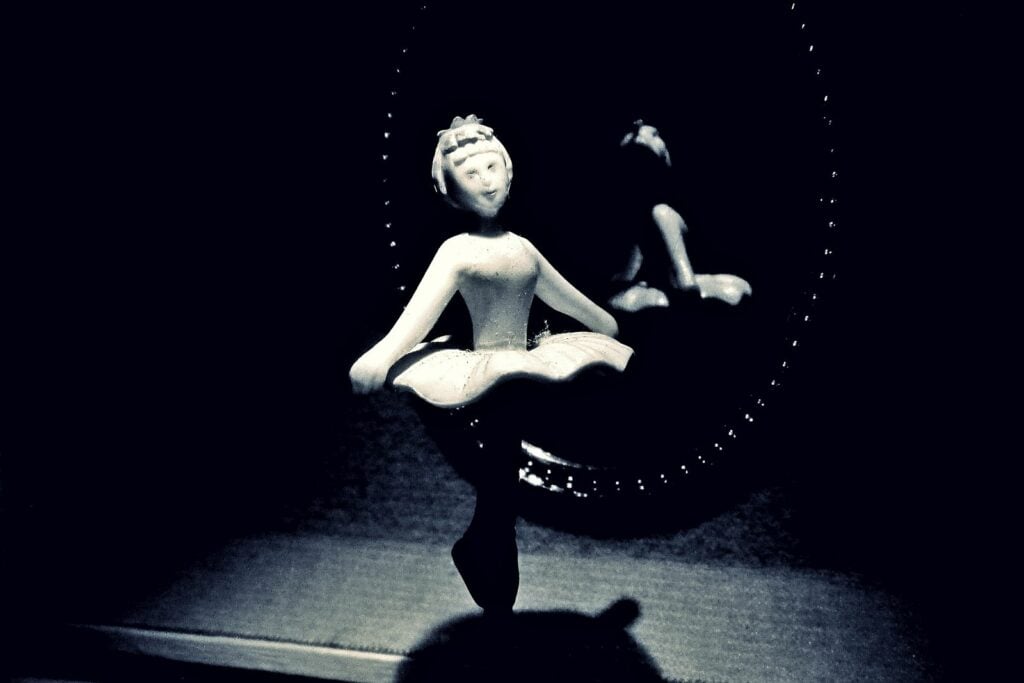 a ballerina figure twirling inside a music box