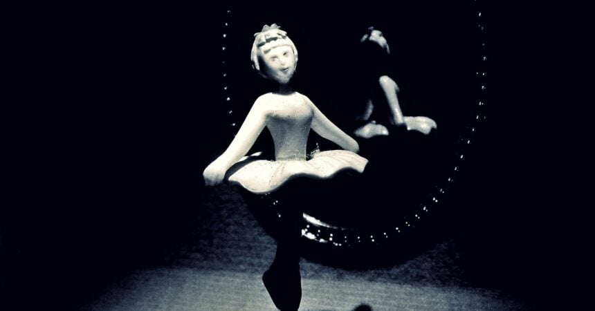 a ballerina figure twirling inside a music box