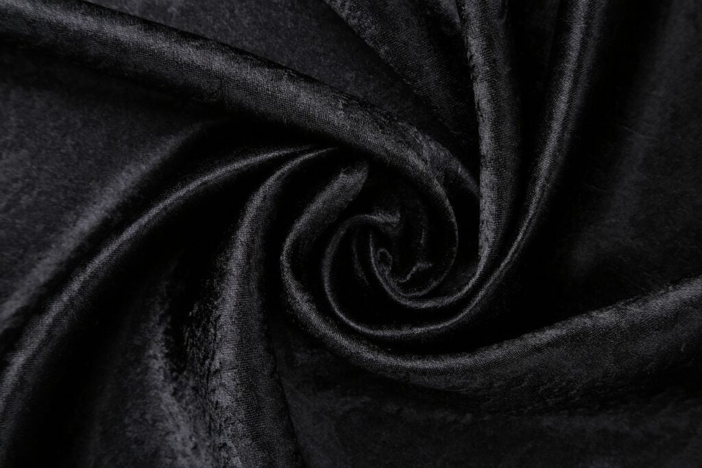 a swirl of black velvet fabric