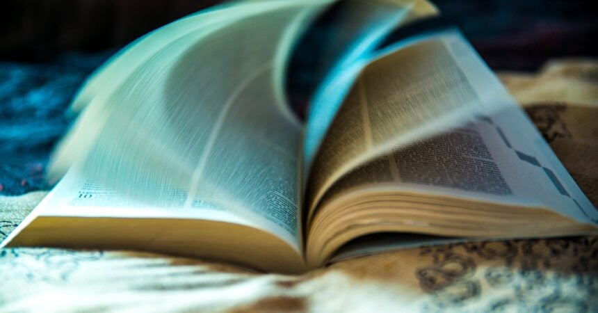a book opening, pages in motion