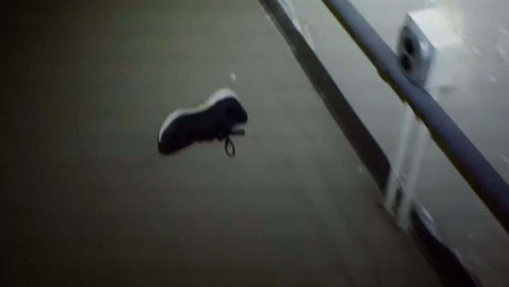 an abandoned sneaker lying on its side on the floor