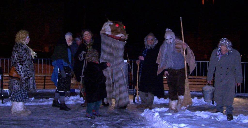 a person costumed as the goat-serpent creature badalisc, captured on epiphany by the townspeople of Andrista, Italy