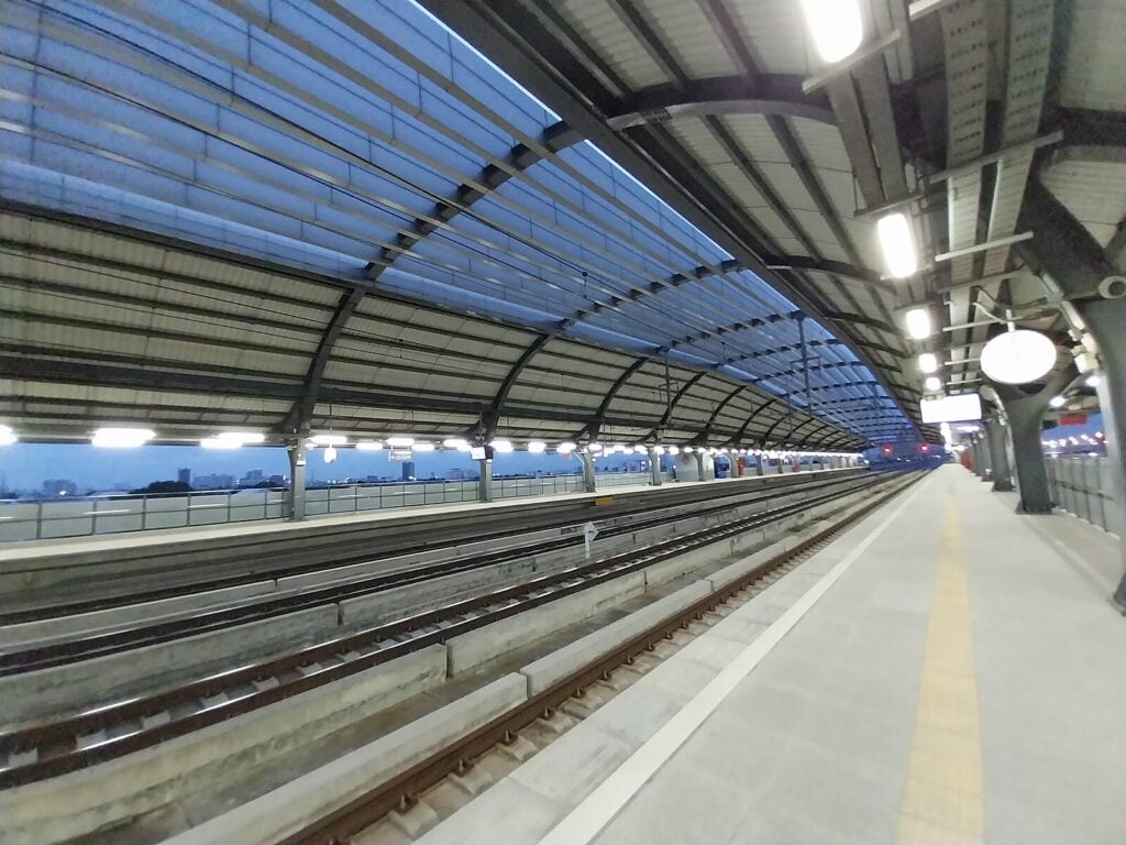 the tracks and platform at the Wat Samian Nari train station in Bangkok, Thailand