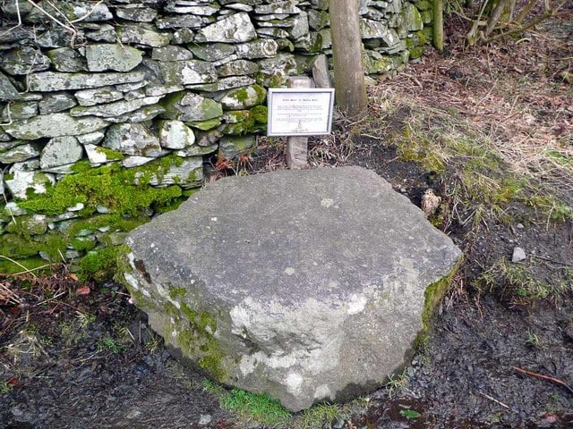 a coffin stone - a large stone left alongside a corpse road for coffin bearers to rest on during the journey
