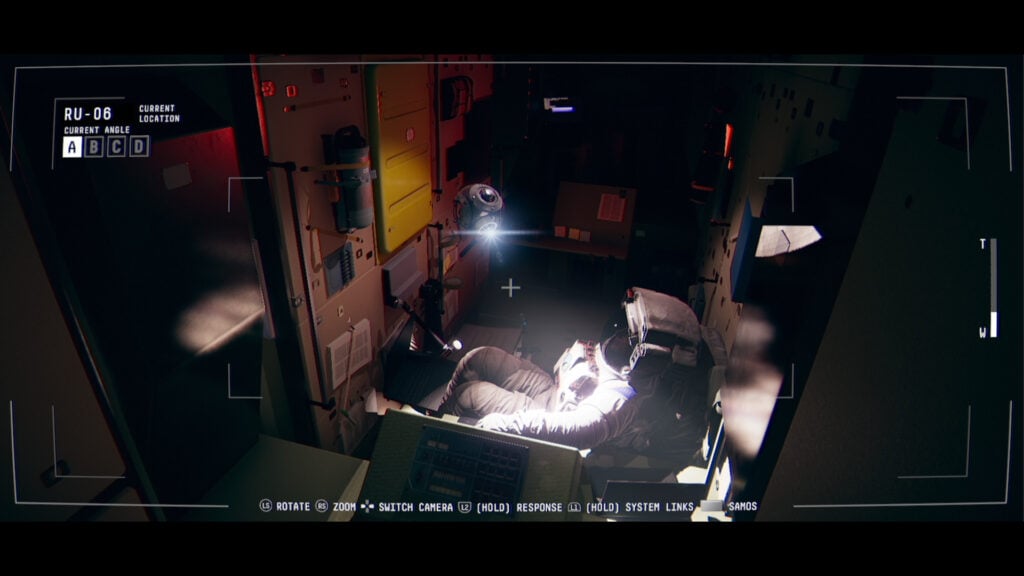 a screenshot from the video game Observation showing a camera feed of an astronaut in a dark, mechanical-looking space