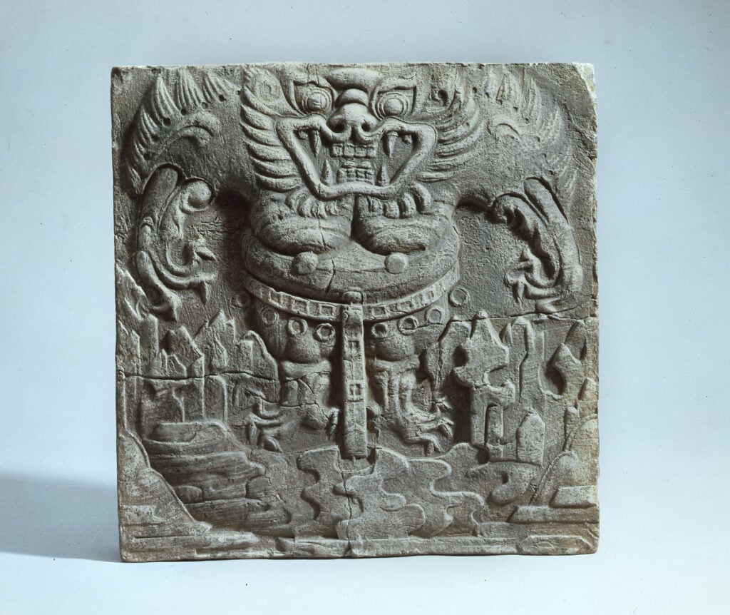 an ancient piece of pottery depicting a dokkaebi, or Korean goblin